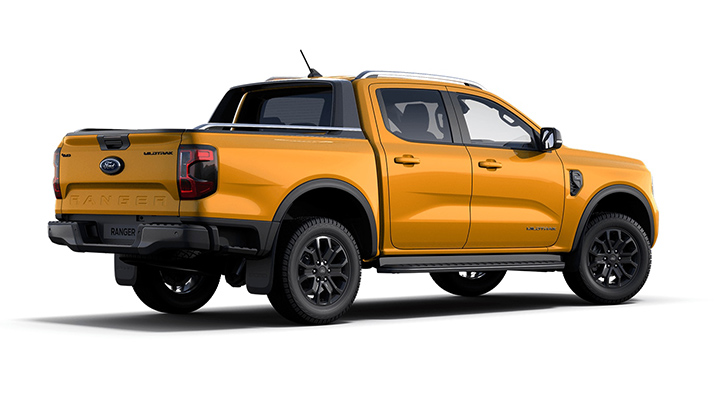 Gelber Ford Ranger Pickup im Profil, mit sportlichem Design und robusten Reifen.