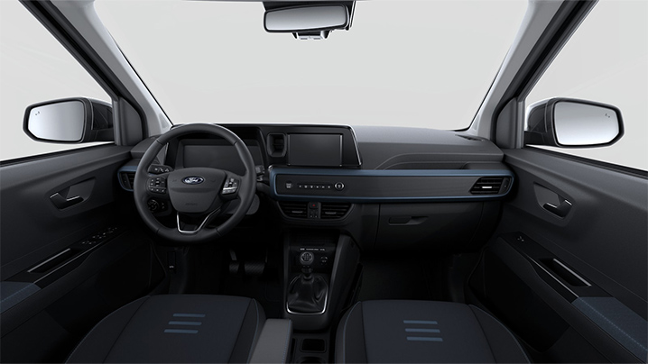 Innenansicht eines Ford Fahrzeugs mit modernem Armaturenbrett, Lenkrad und Schaltknüppel.