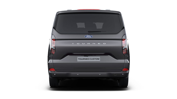 Heckansicht eines grauen Ford Tourneo Custom mit dem Schriftzug TOURNEO auf der Rückseite.