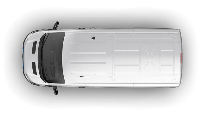 Überkopfansicht eines weißen Fahrzeugs mit flachem Dach und klaren Linien.